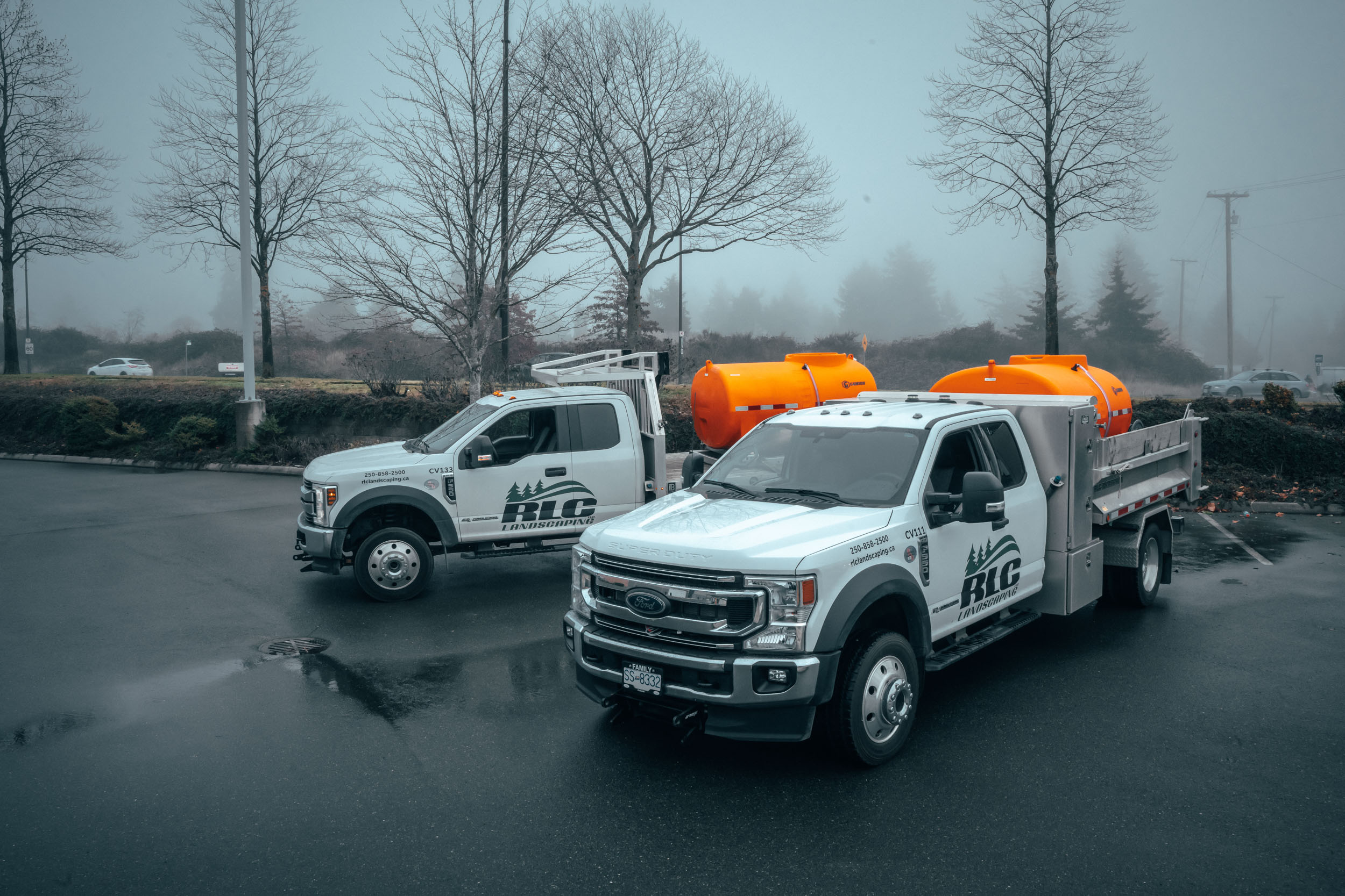 A photo of RLC landscaping vehicles